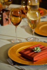 Gold and red themed wedding place setting
